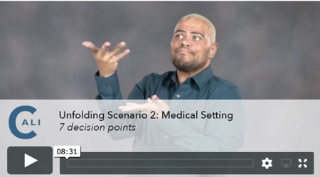 A black man with a brown beard and blond hair wearing a green button down shirt signs. Across the screen reads Unfolding Scenario 2: Medical Setting - Decision Points